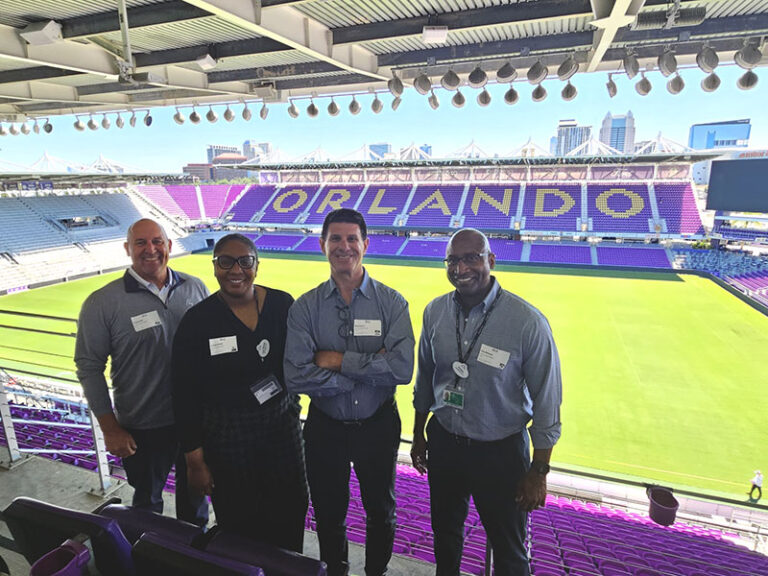 Smart City Telecom Named Proud Partner of Orlando City SC - group photo. Connectivity at Large Sports Events